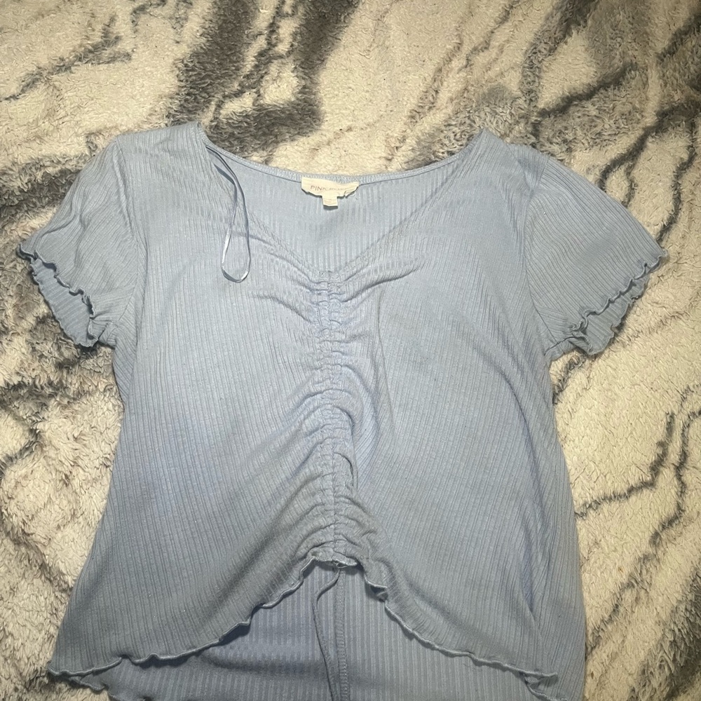 Baby blue short sleeve shirt.